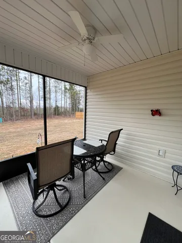 a view of a workspace with furniture