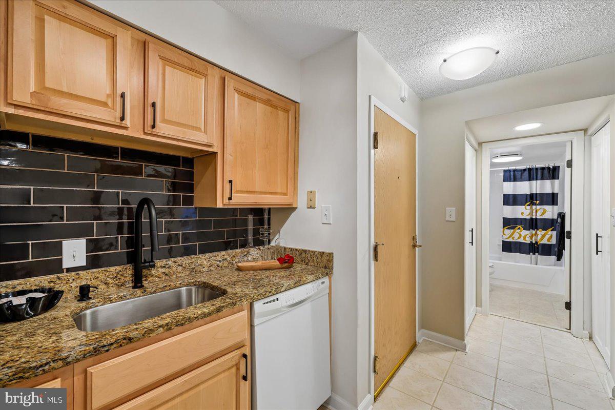 2111 Wisconsin Avenue Northwest, Unit 118 Washington, DC 20007 - Photo 13 of 61 a kitchen with appliances cabinets and a counter top space