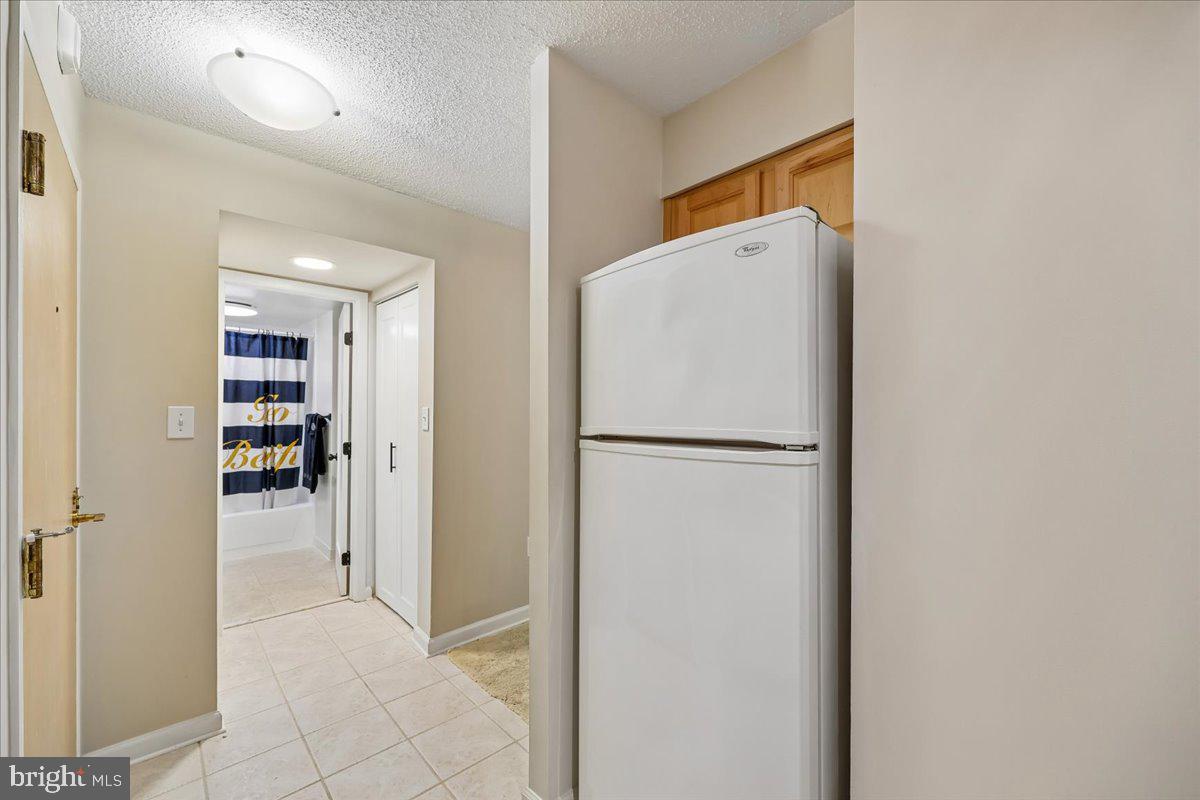 2111 Wisconsin Avenue Northwest, Unit 118 Washington, DC 20007 - Photo 14 of 61 a view of a kitchen with a refrigerator and a refrigerator