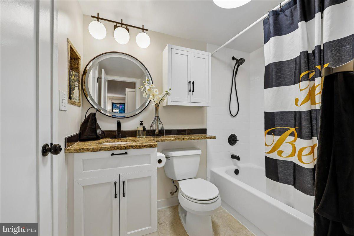 2111 Wisconsin Avenue Northwest, Unit 118 Washington, DC 20007 - Photo 17 of 61 a bathroom with a sink a toilet and shower