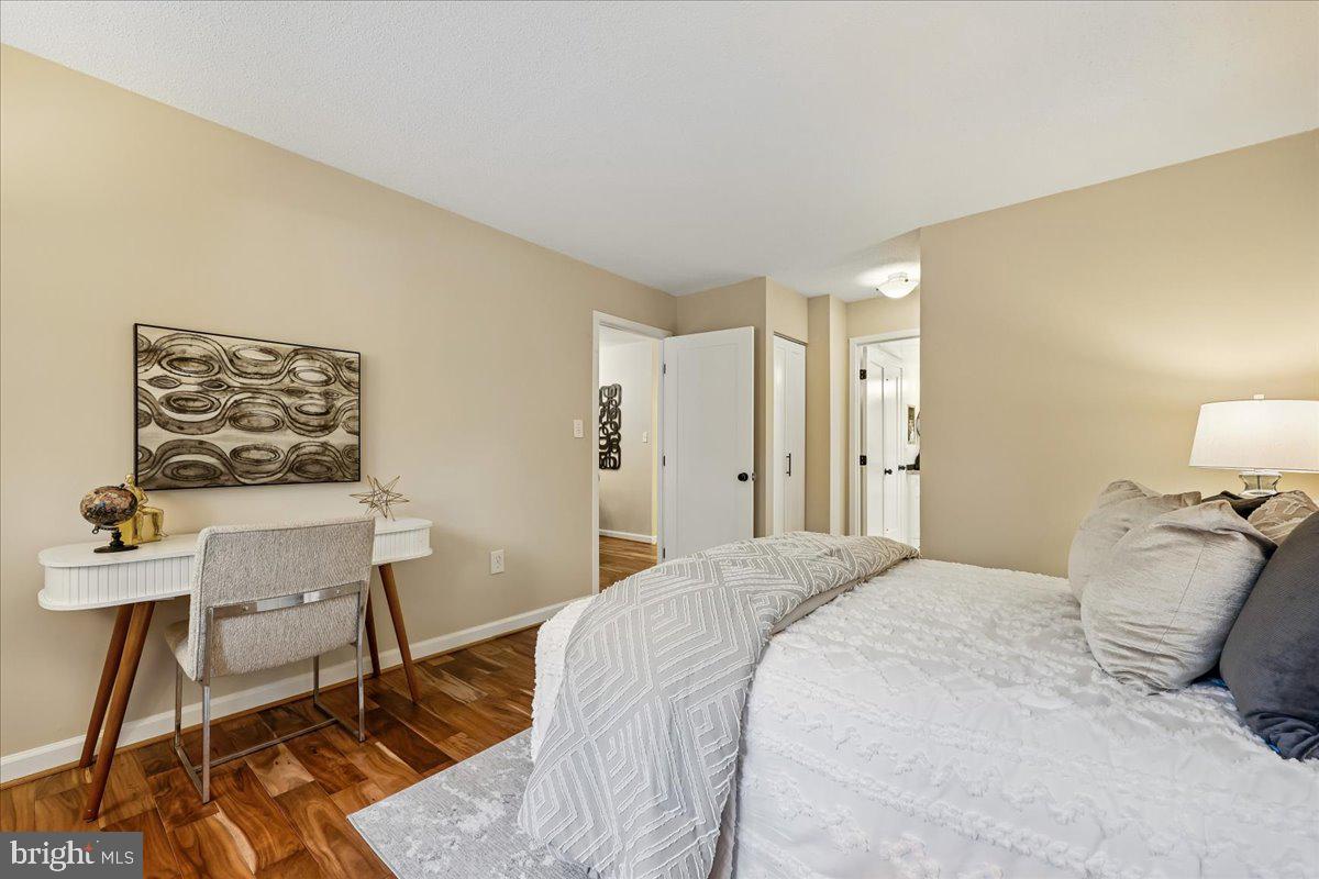 2111 Wisconsin Avenue Northwest, Unit 118 Washington, DC 20007 - Photo 23 of 61 a bedroom with a bed and a table in it