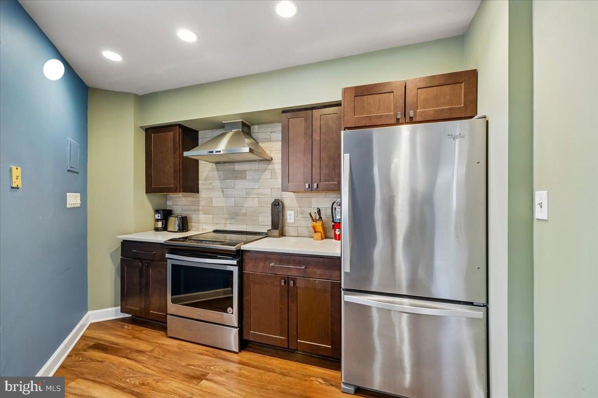 2111 Wisconsin Avenue Northwest, Unit 118 Washington, DC 20007 - Photo 46 of 61 a kitchen with stainless steel appliances granite countertop a refrigerator a stove a sink and a microwave