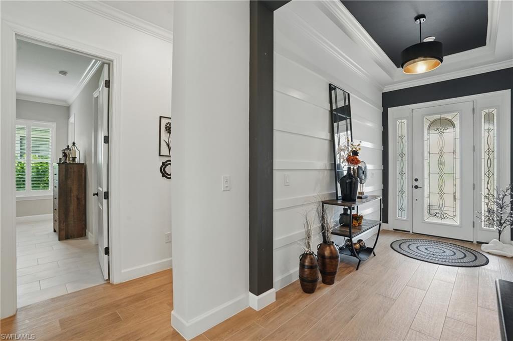 17467 Caravita Lane Fort Myers, FL 33913 - Photo 2 of 50 a view of an entryway with wooden floor