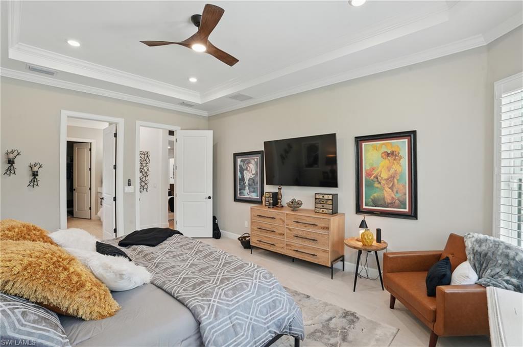 17467 Caravita Lane Fort Myers, FL 33913 - Photo 22 of 50 a bedroom with a bed couch and window