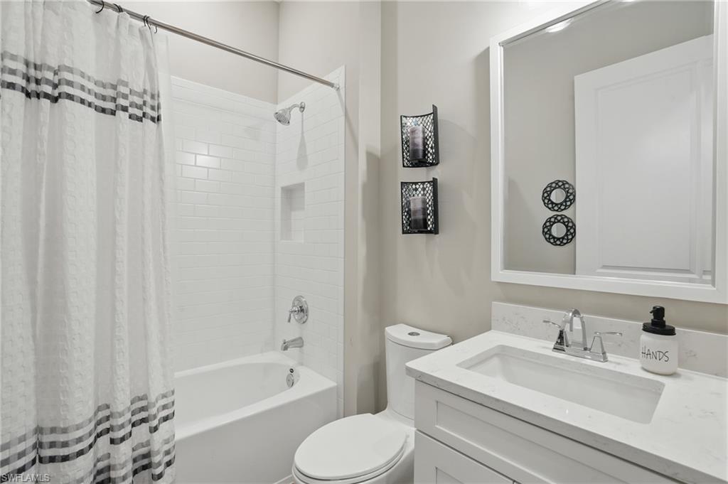 17467 Caravita Lane Fort Myers, FL 33913 - Photo 28 of 50 a bathroom with a sink toilet and shower