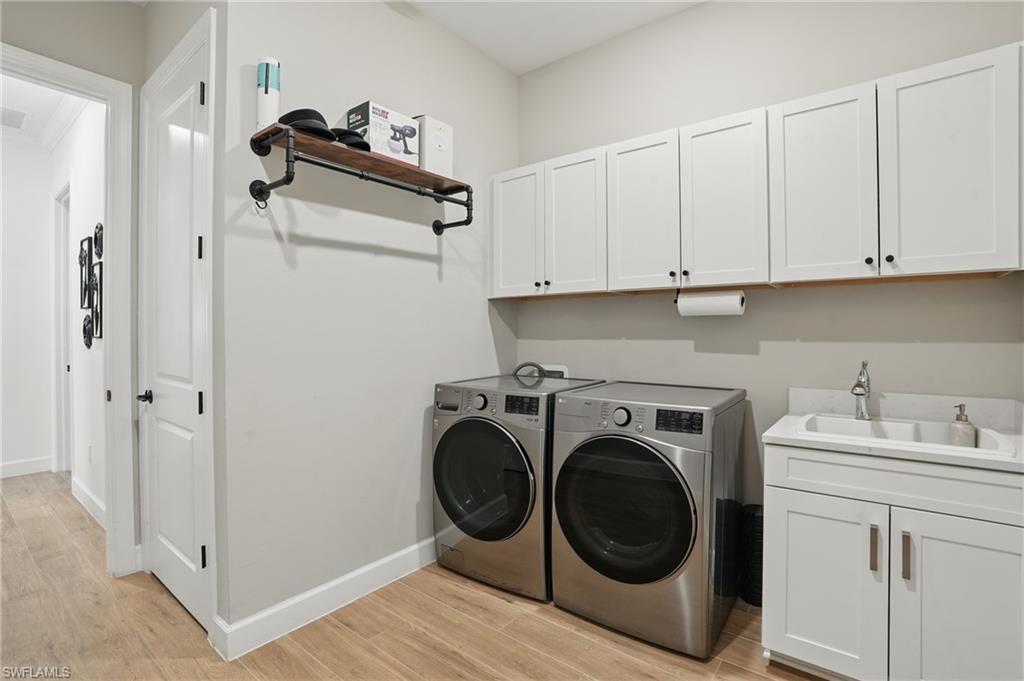 17467 Caravita Lane Fort Myers, FL 33913 - Photo 29 of 50 a utility room with sink dryer and washer