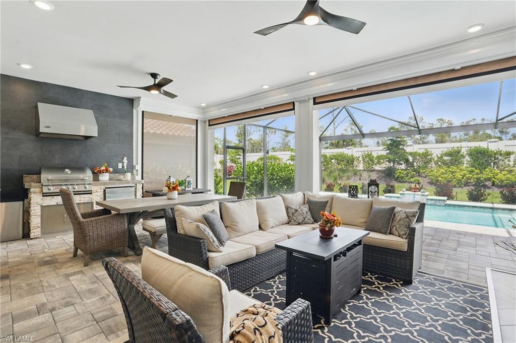 17467 Caravita Lane Fort Myers, FL 33913 - Photo 33 of 50 a living room with furniture and a large window