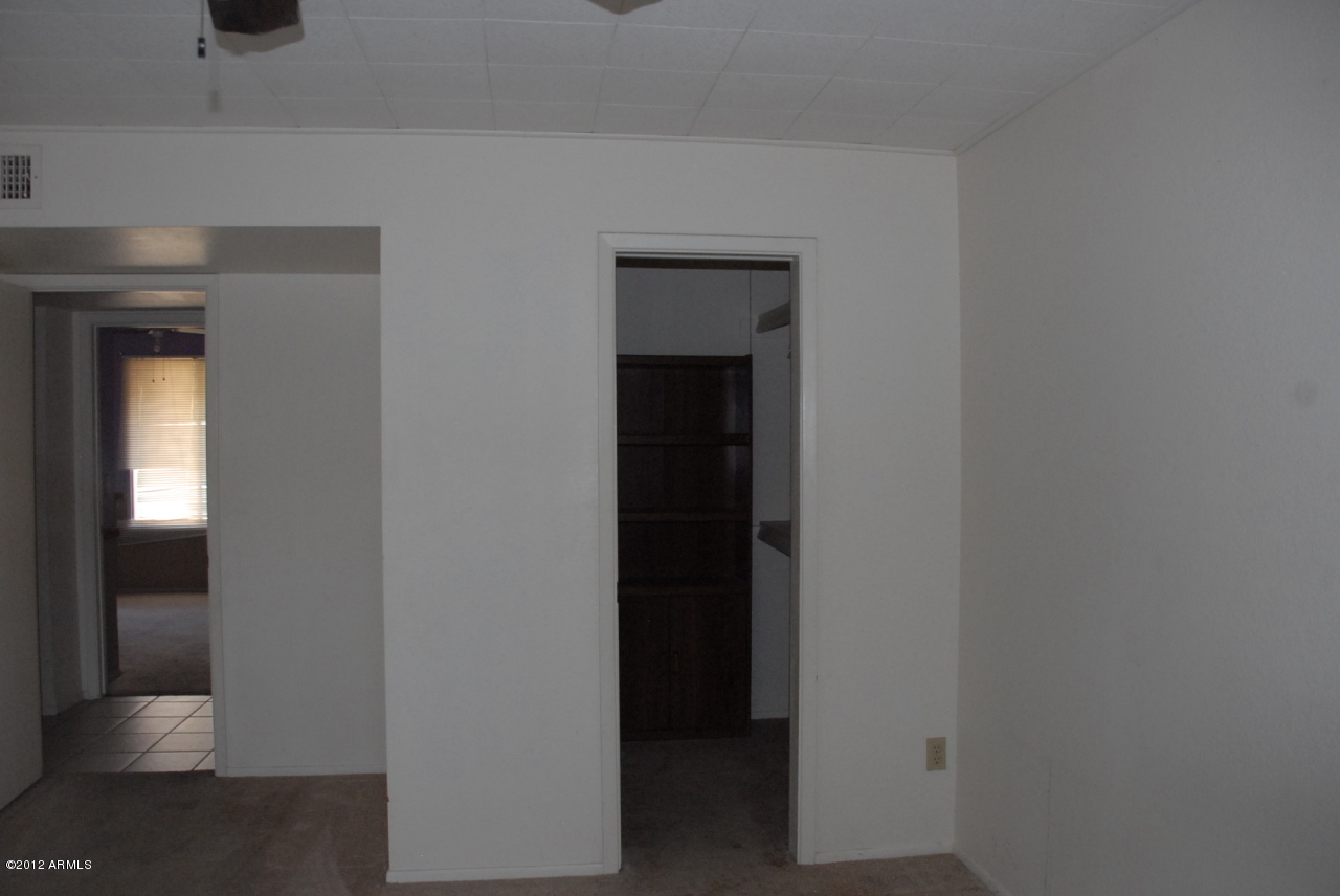 3008 West Redfield Road Phoenix, AZ 85053 - Photo 14 of 29 Master bedroom lookng at closet and door