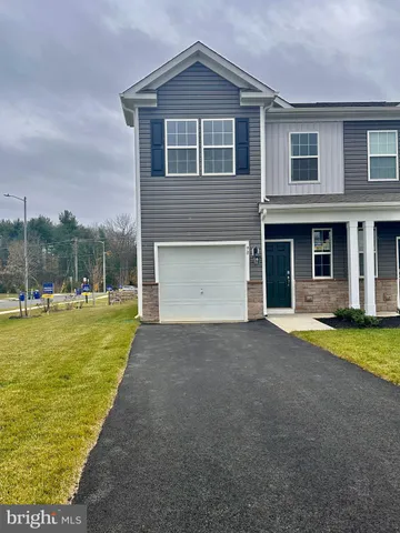 a front view of house with outdoor space and swimming pool