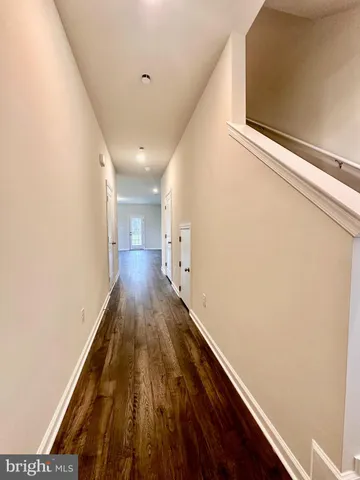 a view of gallery with wooden floor