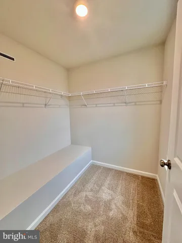 a view of a room with racks on the wall