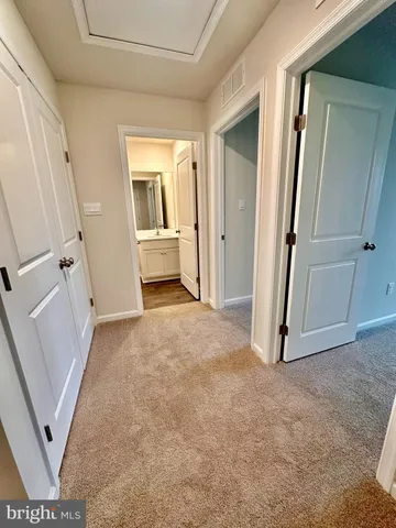 an entryway with a rug