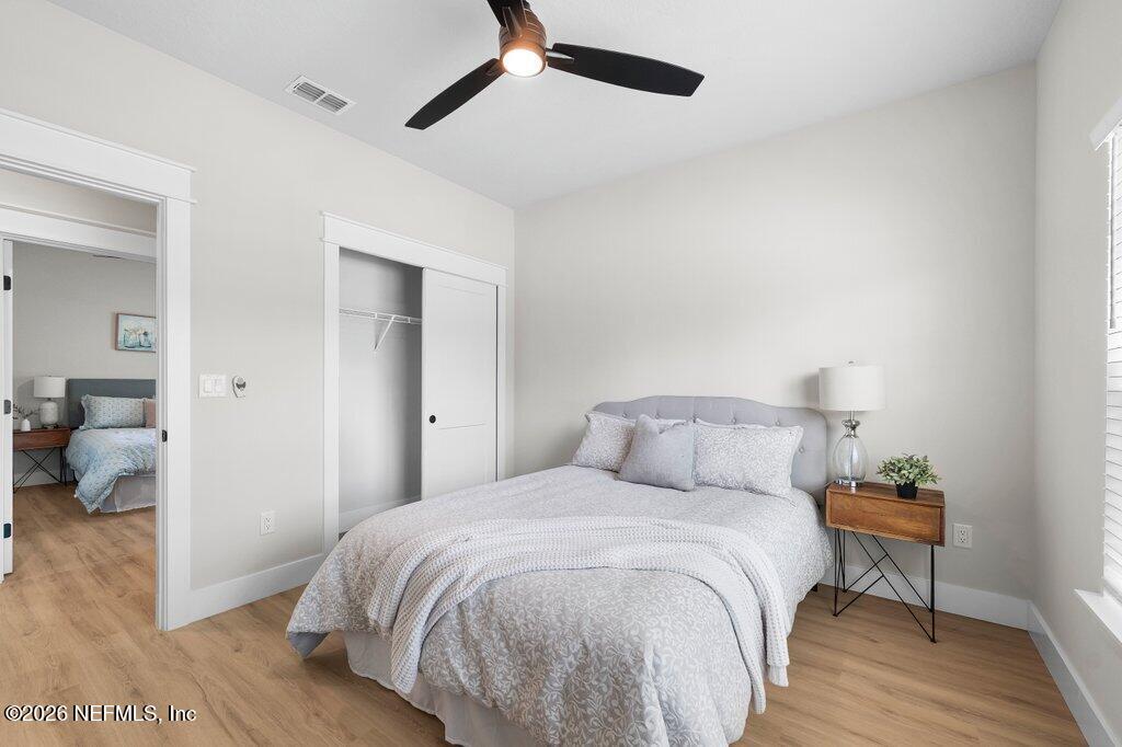 9019 Hipps Road Jacksonville, FL 32222 - Photo 11 of 35 a bedroom with a bed and a table