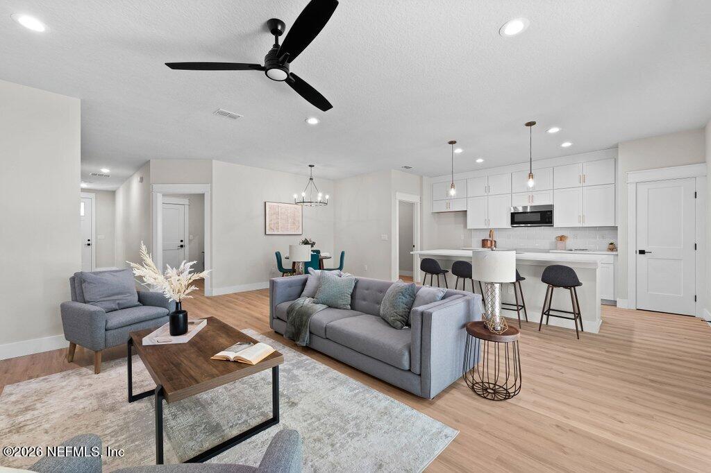 9019 Hipps Road Jacksonville, FL 32222 - Photo 21 of 35 a living room with furniture and kitchen view