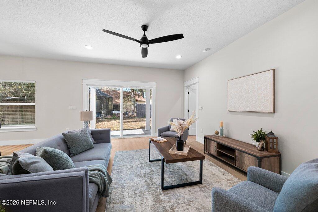 9019 Hipps Road Jacksonville, FL 32222 - Photo 25 of 35 a living room with furniture and a large window