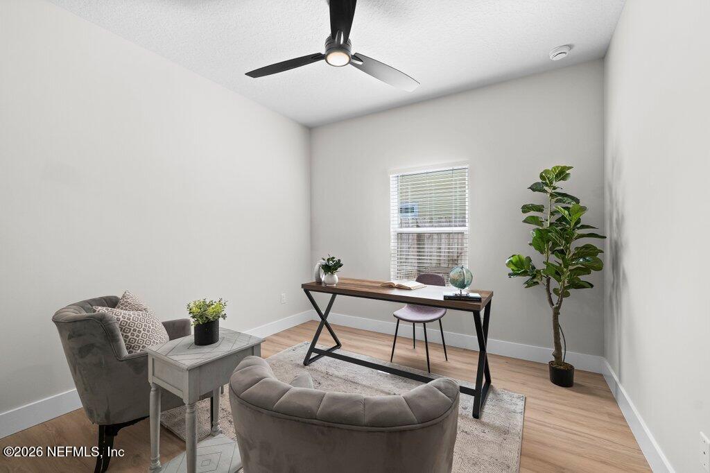 9019 Hipps Road Jacksonville, FL 32222 - Photo 28 of 35 a living room with furniture and a potted plant