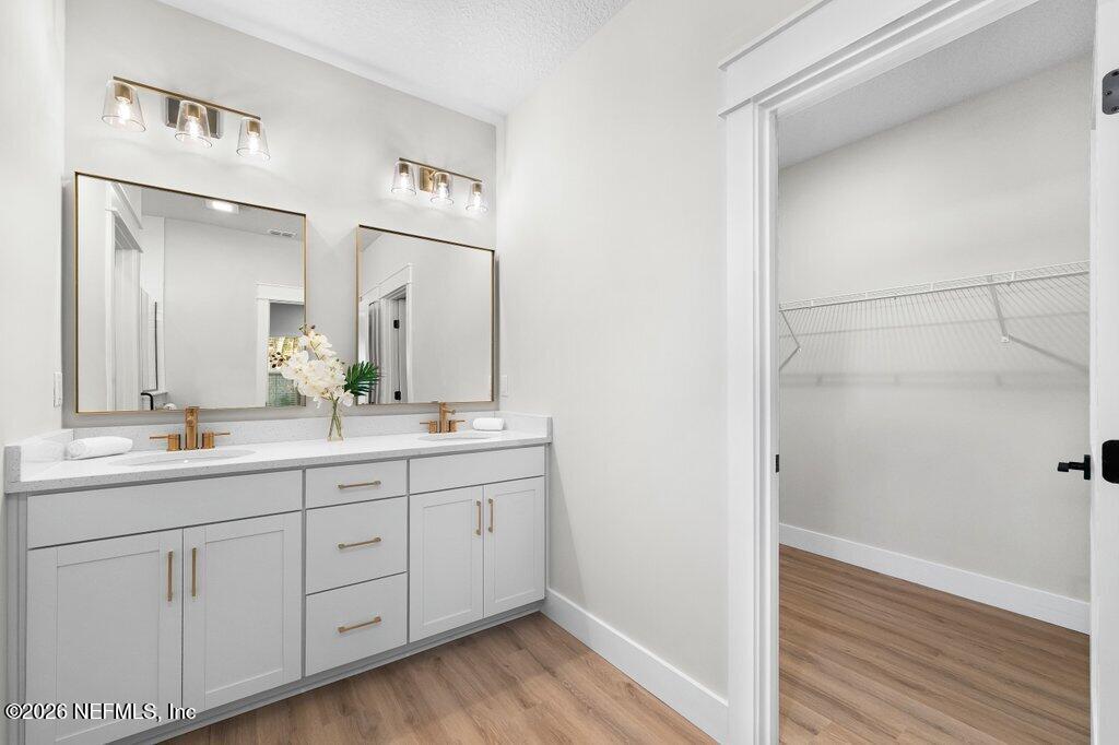 9019 Hipps Road Jacksonville, FL 32222 - Photo 33 of 35 a bathroom with a double vanity sink and mirror