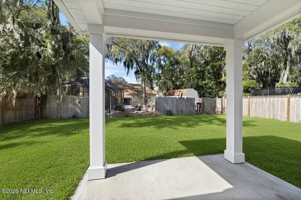 a bedroom with a bed and a table