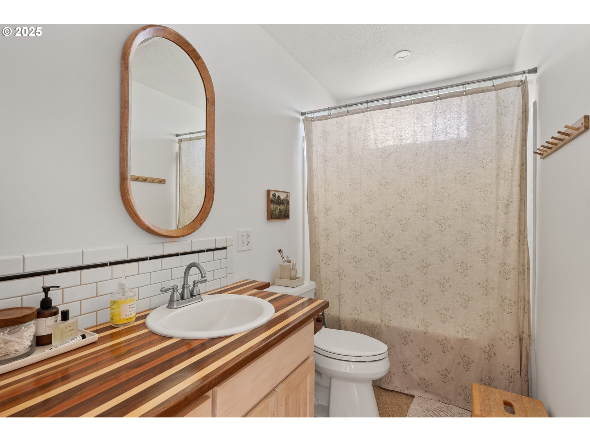 118 Eadon Road Toledo, WA 98591 - Photo 17 of 42 a bathroom with a sink a toilet and a mirror