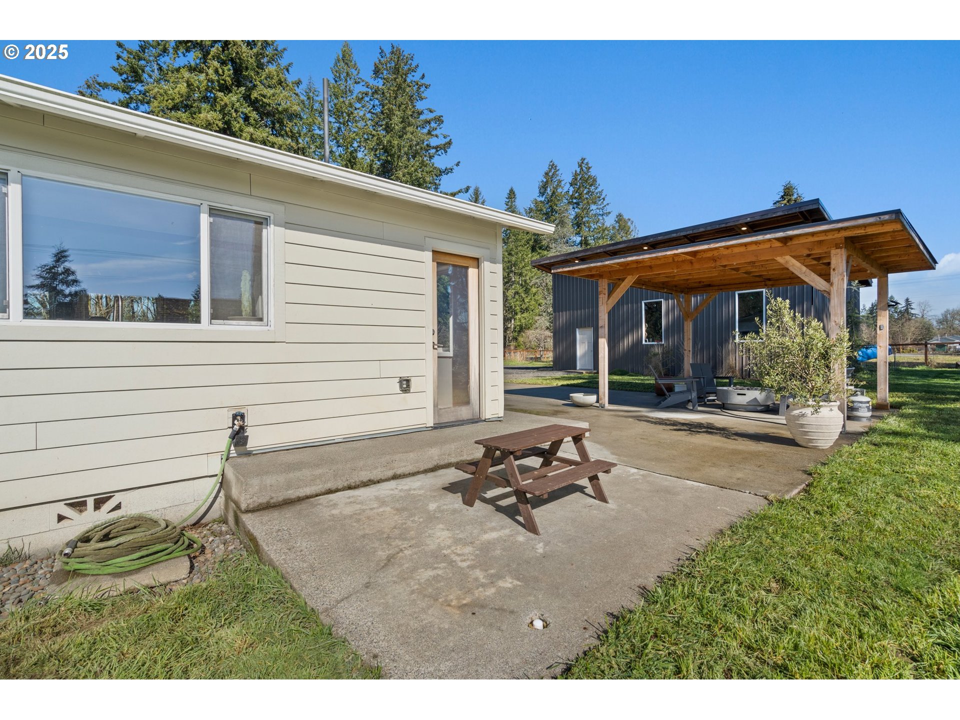 118 Eadon Road Toledo, WA 98591 - Photo 20 of 42 a backyard of a house with table and chairs