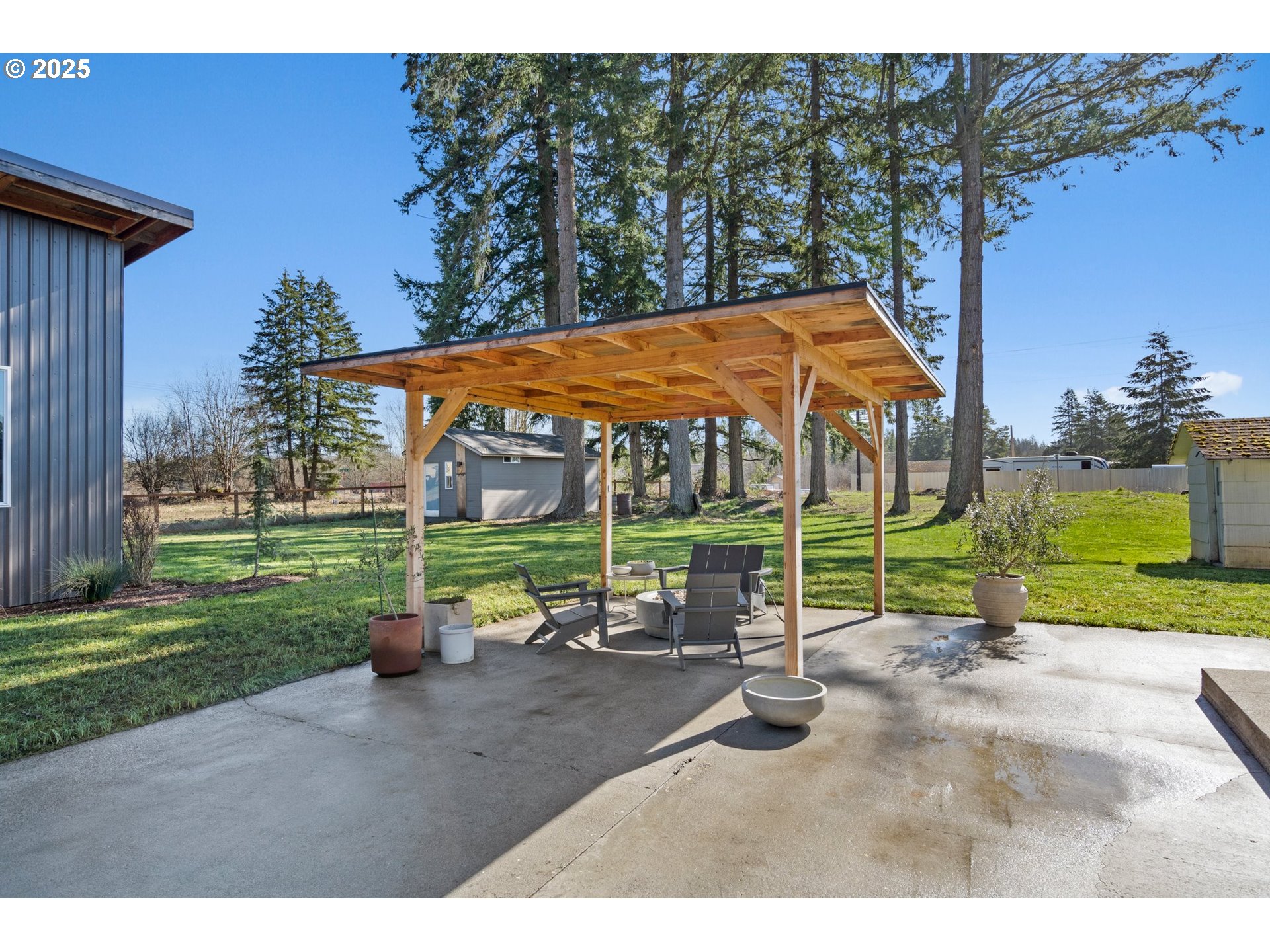 118 Eadon Road Toledo, WA 98591 - Photo 21 of 42 a backyard of a house with barbeque oven table and chairs