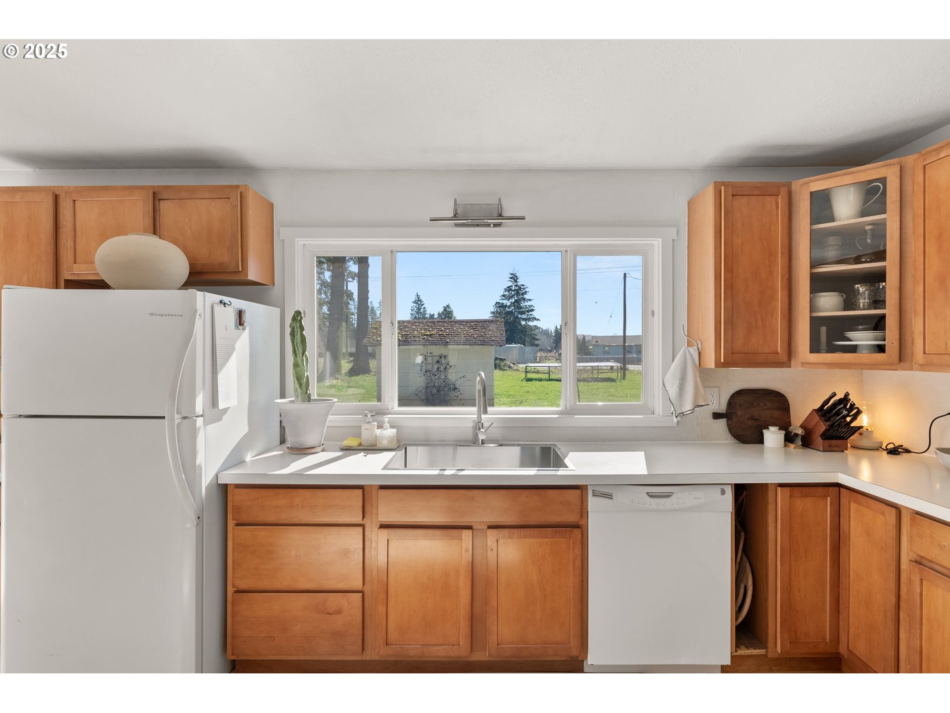 118 Eadon Road Toledo, WA 98591 - Photo 10 of 42 a kitchen with a refrigerator a sink and a window