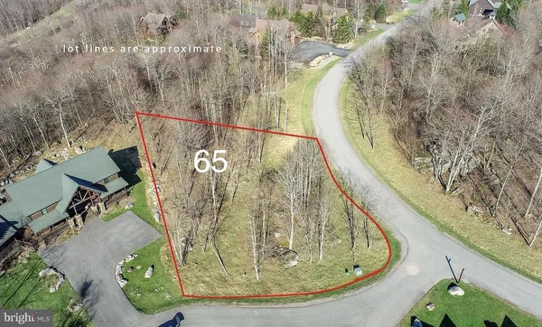 a view of a swimming pool with sitting area