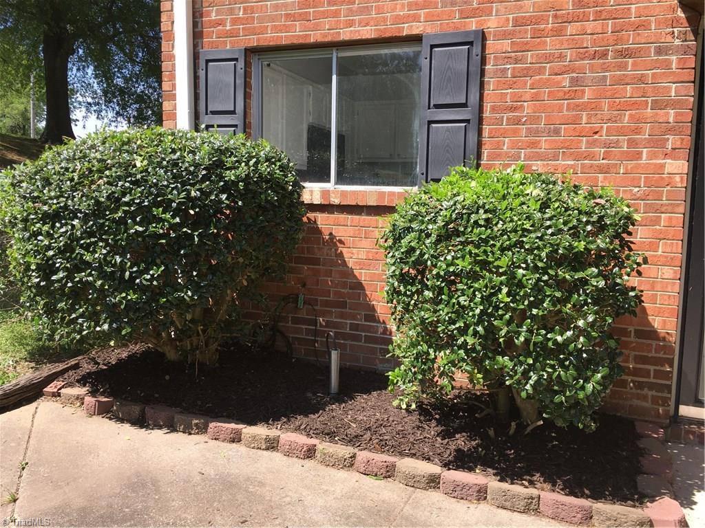 2218 A Shadow Valley Road, Unit A High Point, NC 27265 - Photo 2 of 23 Fresh mulch and double window allowing natural light into the kitchen