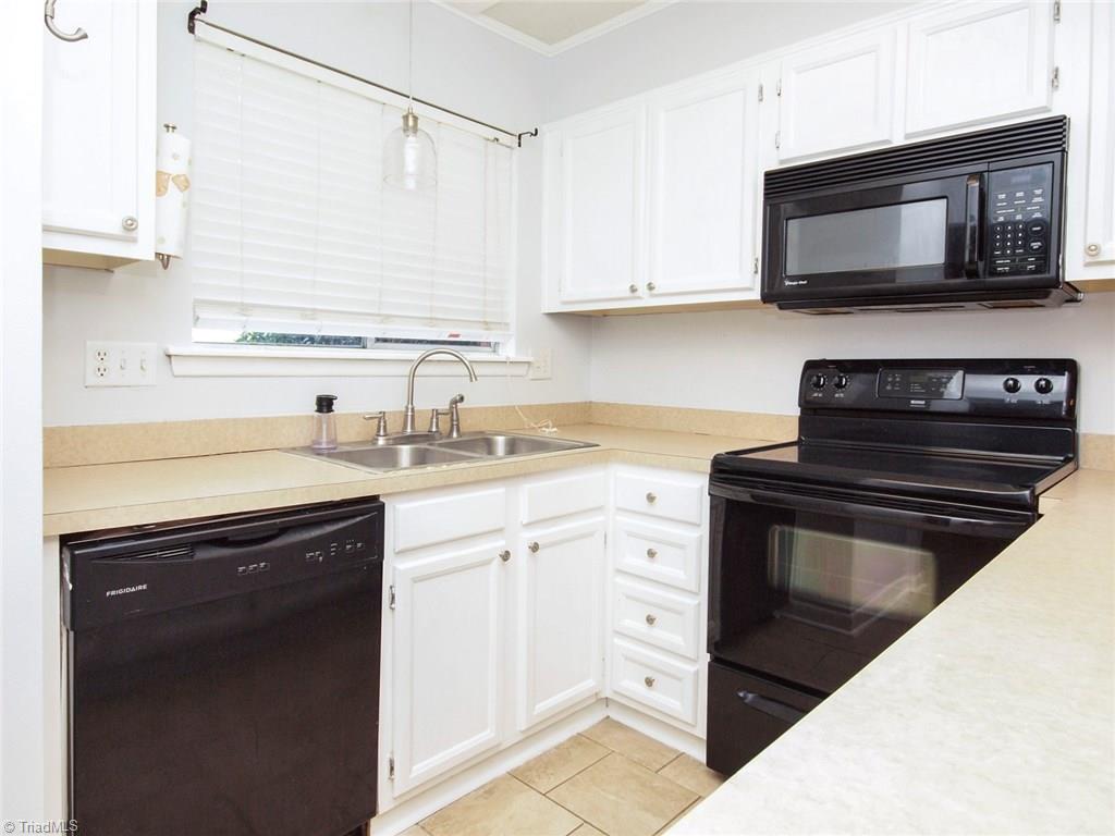2218 A Shadow Valley Road, Unit A High Point, NC 27265 - Photo 3 of 23 Kitchen with ceramic tile, newer appliances and fresh paint
