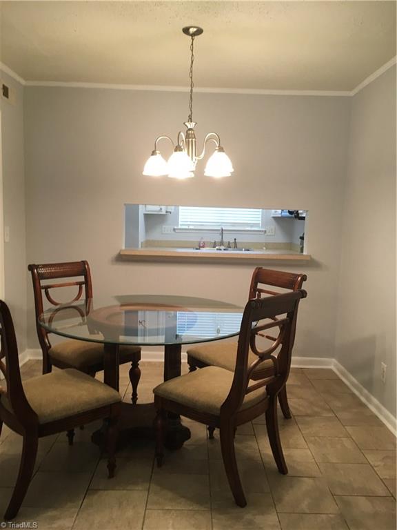 2218 A Shadow Valley Road, Unit A High Point, NC 27265 - Photo 7 of 23 Dining room looking through cutout into kitchen