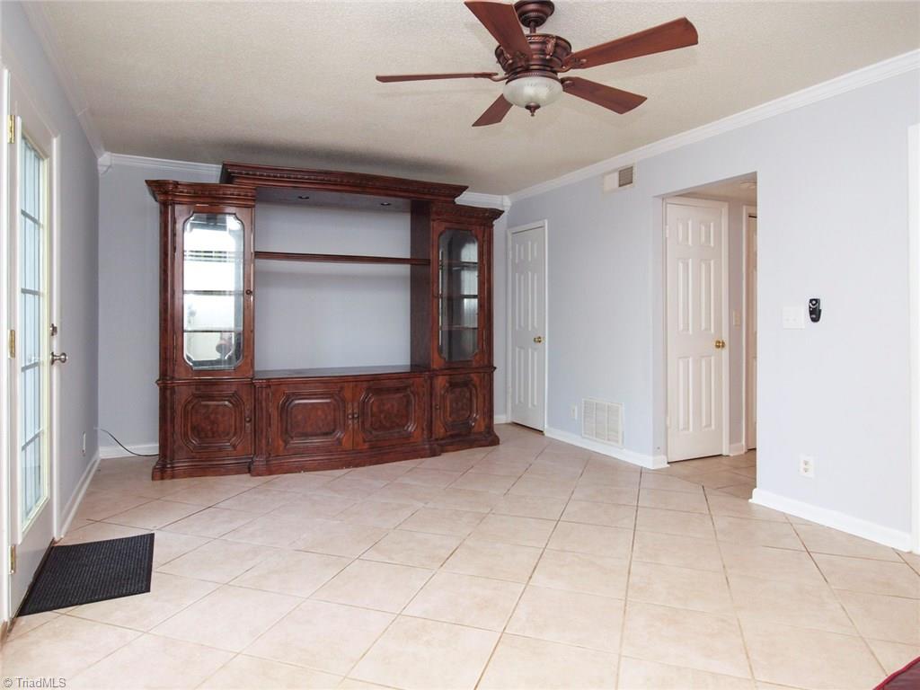 2218 A Shadow Valley Road, Unit A High Point, NC 27265 - Photo 10 of 23 Roomy living room with storage closet in corner under stairs