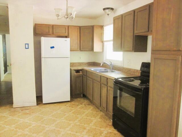 5574 Providence Church Road Ferrum, VA 24088 - Photo 7 of 17 a kitchen with a stove a sink and a refrigerator