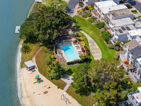 an aerial view of a house with a yard and garden