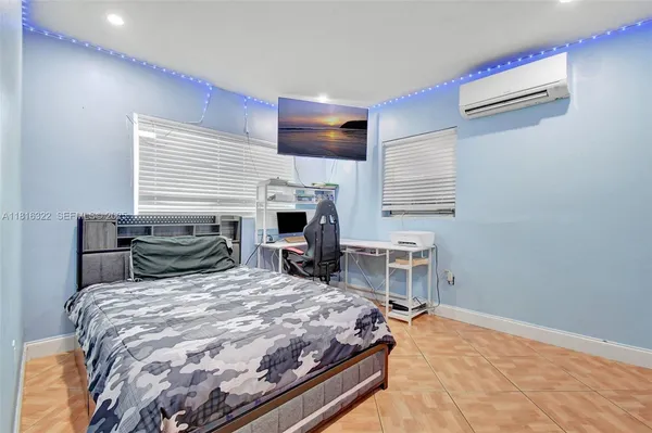 a bedroom with a bed and a table in it