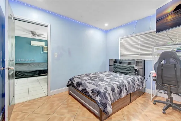 a bedroom with a bed and a mirror
