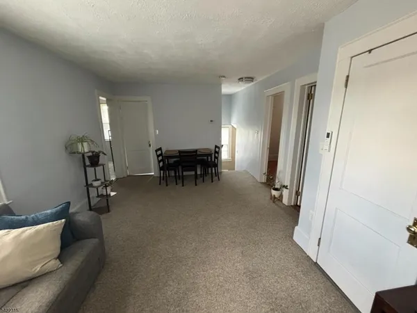a view of livingroom with furniture and window