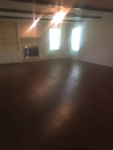 a view of an empty room and window