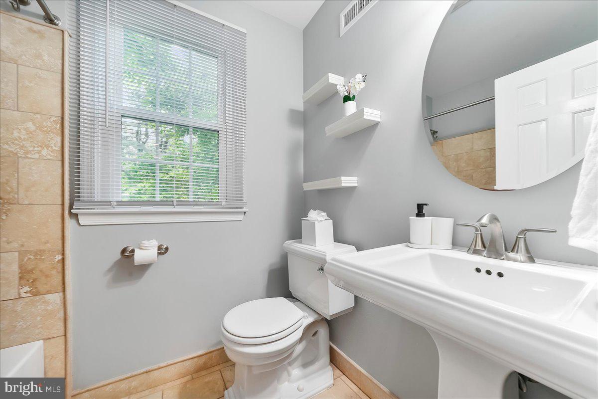 686 Limehouse Road Wayne, PA 19087 - Photo 39 of 51 a bathroom with a toilet a sink and mirror