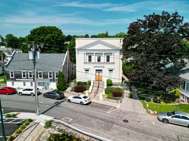 a view of multiple houses with a yard