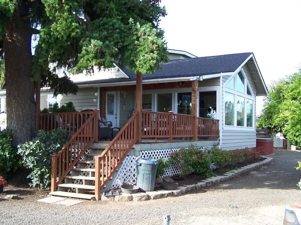 211 Sharp Road Tieton, WA 98947 - Photo 2 of 14 a front view of a house with a porch