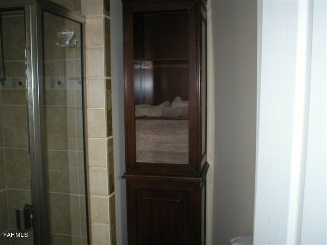 211 Sharp Road Tieton, WA 98947 - Photo 9 of 14 a bathroom with a glass door