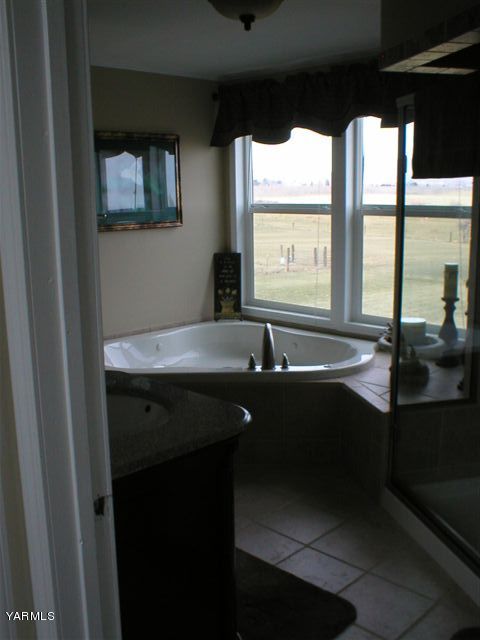 211 Sharp Road Tieton, WA 98947 - Photo 10 of 14 a bathroom with a sink and a window