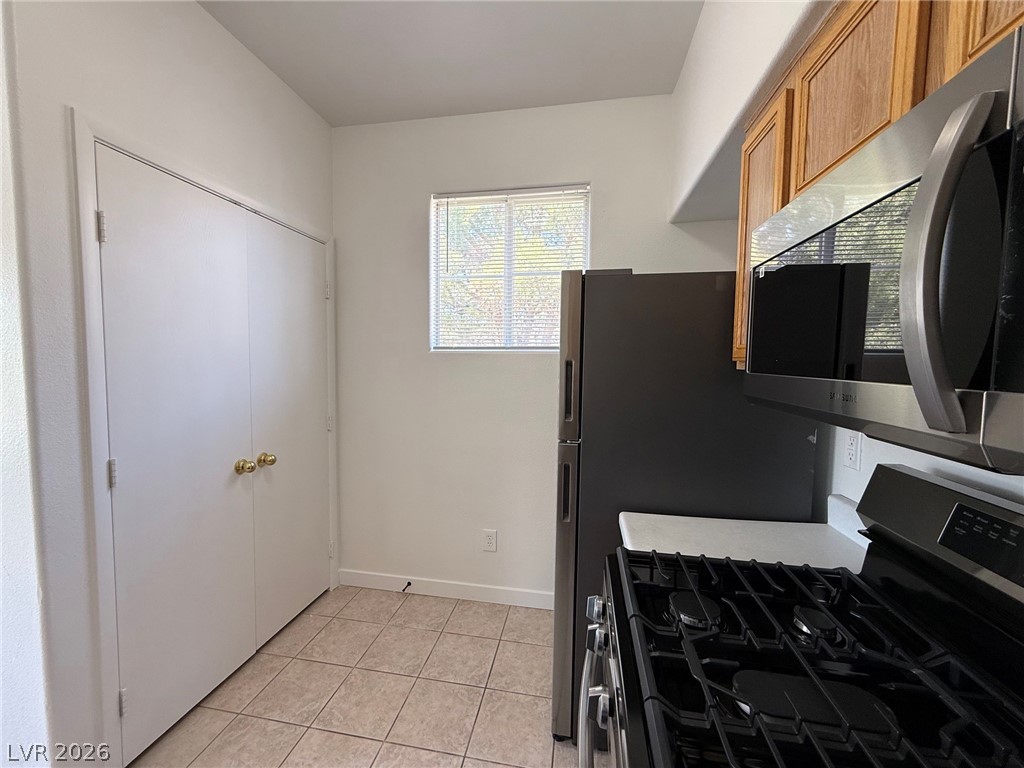 9050 West Warm Springs Road, Unit 2002 Las Vegas, NV 89148 - Photo 16 of 46 This functional kitchen features modern appliances and ample cabinet space.