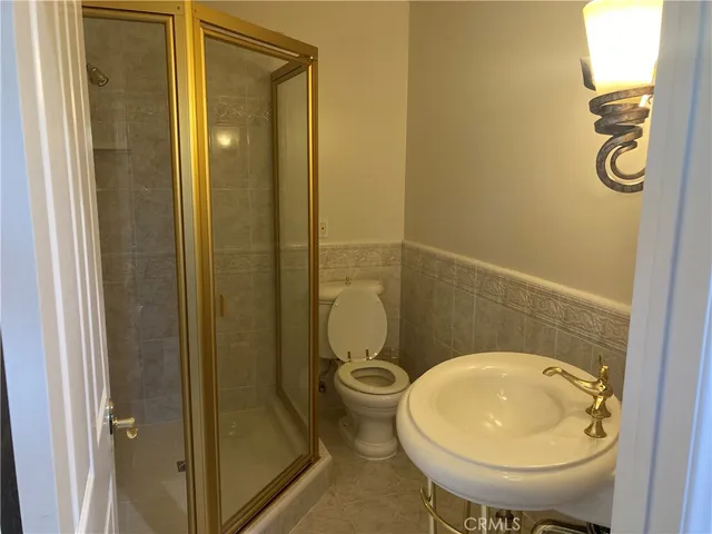 a bathroom with a toilet and a sink