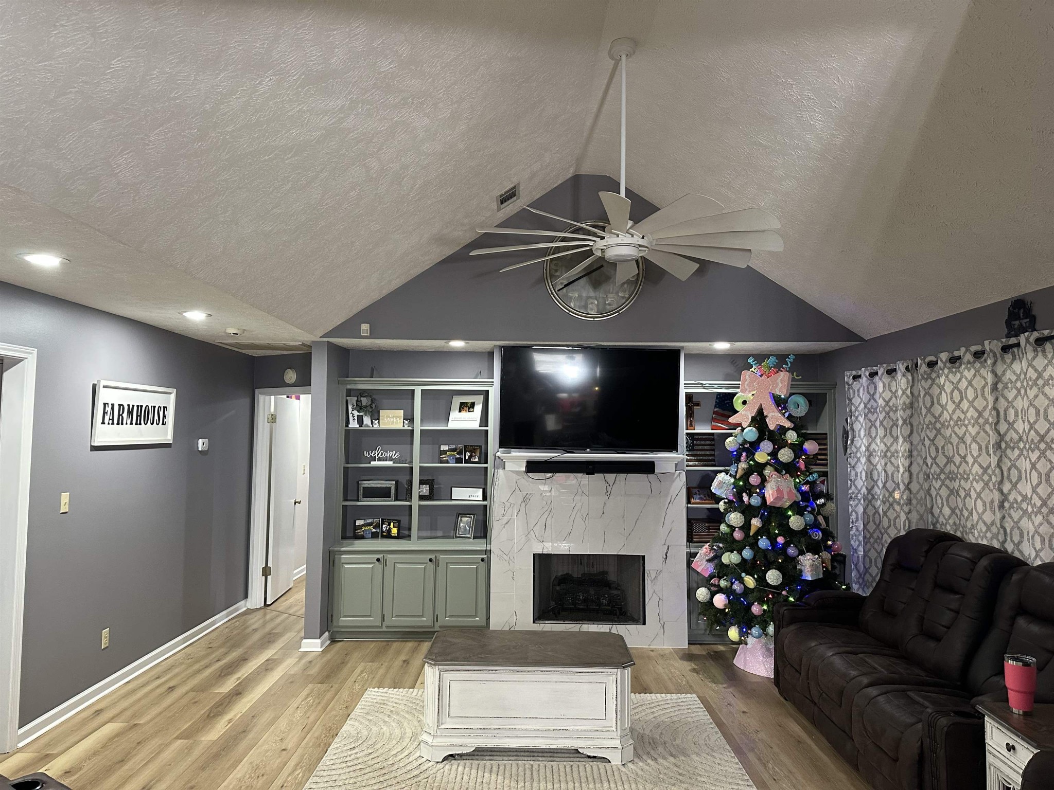 58 Bowman Loop Beech Bluff, TN 38313 - Photo 11 of 40 a living room with furniture a flat screen tv and a fireplace