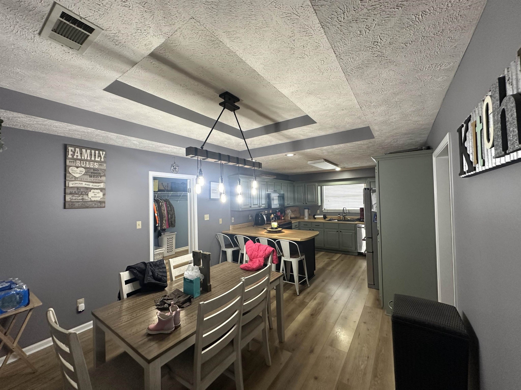58 Bowman Loop Beech Bluff, TN 38313 - Photo 12 of 40 a view of a dining room with furniture wooden floor and a chandelier