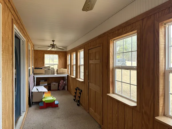 a bedroom with furniture and a window