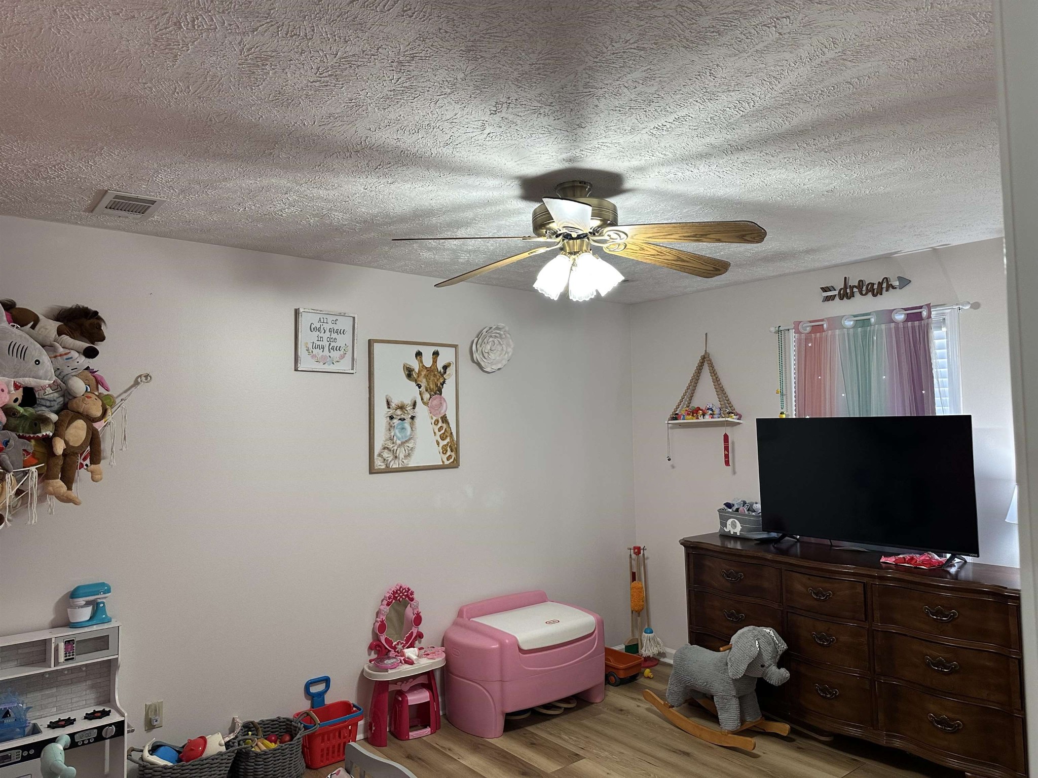 58 Bowman Loop Beech Bluff, TN 38313 - Photo 21 of 40 a bedroom with a bed and a flat screen tv