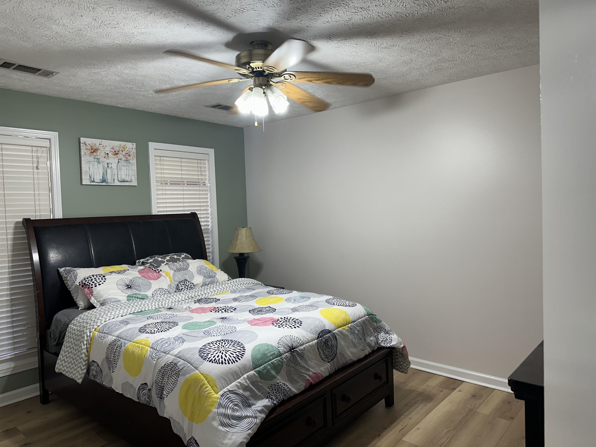 58 Bowman Loop Beech Bluff, TN 38313 - Photo 23 of 40 a bedroom with a bed and a chandelier