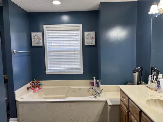 a bathroom with a sink and a bathtub